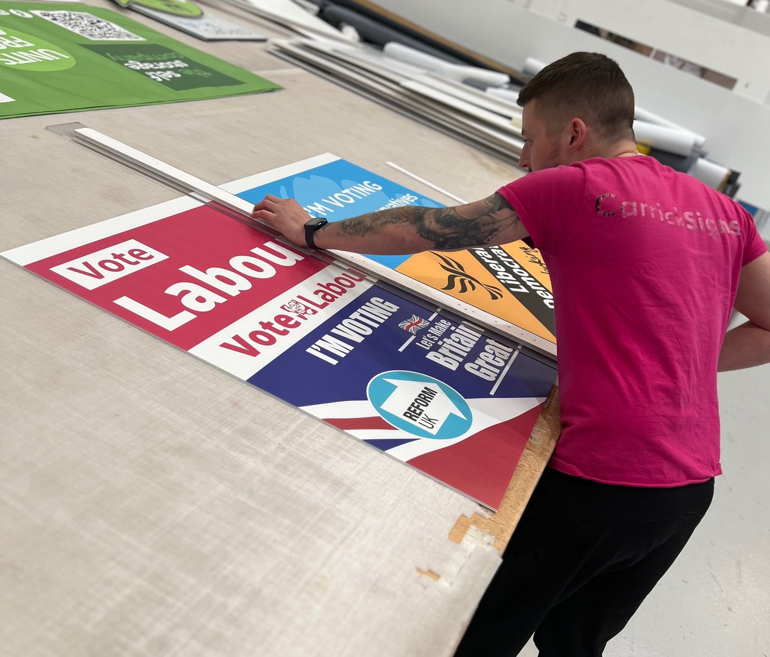 a photo of our flatbed printer cutting out the 4mm correx election boards